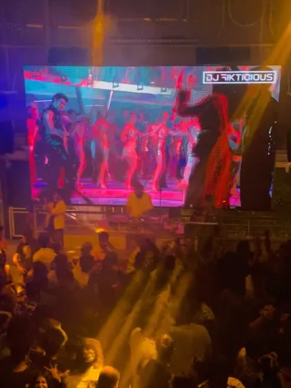 An orchestra of emotions. This shot shows the power of combining music with massive, compelling visuals on the VJ screen, creating a symphony of heartbeats on the dance floor.
