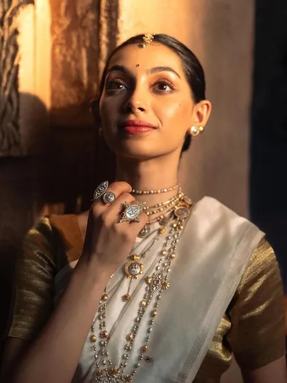 A close-up from a heritage jewelry campaign, where the lighting and expression work together to highlight the stunning craftsmanship. This type of shot is perfect for brands wanting to focus on the intricate beauty and detail of their products.