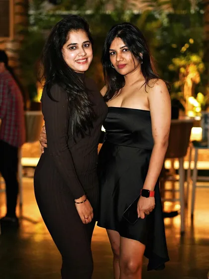 Friends posing for a picture at Pangeo. It's a great spot for a night out with your crew.