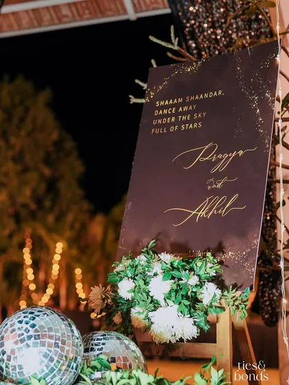 A stylish welcome sign for Pragya and Akhil's Sangeet night. The "Shaam Shaandar" theme was carried through with disco balls and elegant calligraphy, promising a night of stars and dancing.