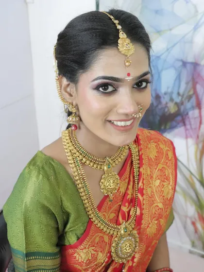 I am incredibly proud of my students' achievements. This flawless South Indian bridal look was created by one of my students, showing the professional quality they achieve through our hands-on training.
