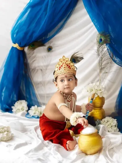 Reaching for the butter pot with a curious look. I love capturing the innocence and playfulness of babies in these traditional themes.