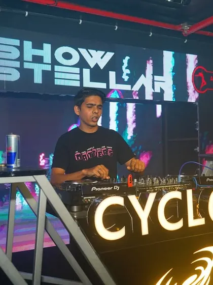 At the decks at Cyclone, Nagpur, with my logo and abstract visuals creating a high-tech vibe.