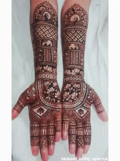 A beautiful example of a multi-pattern bridal design. I included bands of elephants, lotus blooms, and geometric checks, creating a rich texture that covers the hands and forearms completely.