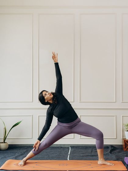 Utthita Parsvakonasana (Extended Side Angle Pose), a deep side stretch that lengthens the entire side body from heel to fingertips.