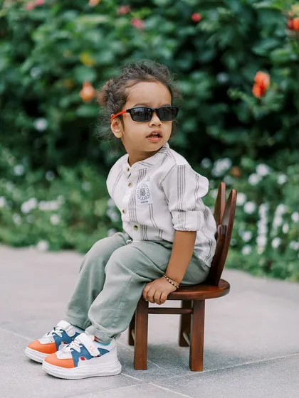 This little guy has so much style. His cool sunglasses and relaxed pose make for a fun and unique toddler portrait.
