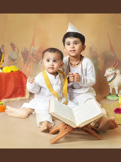 Brothers celebrating together. An older brother and his baby brother dressed as Varkaris for a memorable cultural photoshoot.