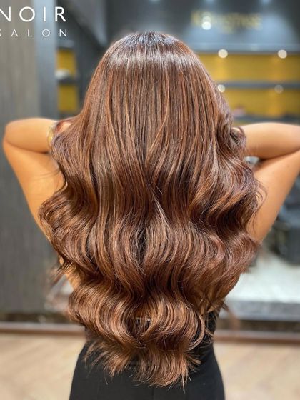 The back view of this Friday feature, showing off the full length and volume of the beautifully colored and styled hair.