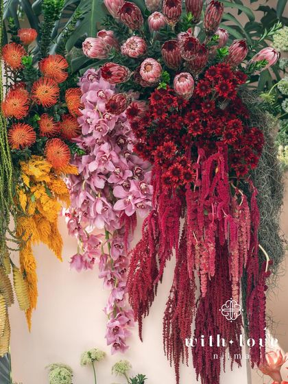 A close-up of the vibrant, cascading florals from the 'Garden of Gaia' wall.