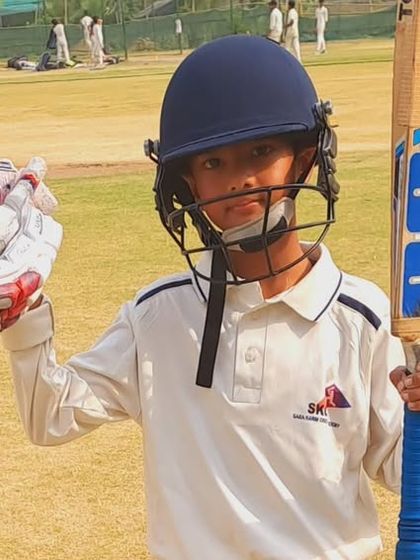 A young batsman from the Tigers team, proud after a successful match. We ensure all our promoted trainees get a chance to prove themselves in matches.