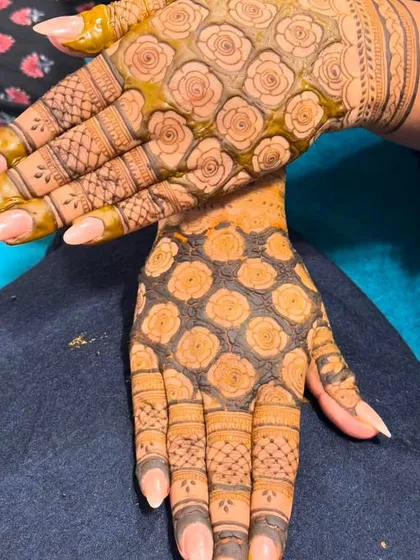This design features a dense grid of roses on the palm, a modern take on traditional floral patterns. The back of the hand has a different floral grid.