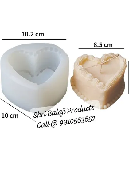 A heart-shaped cake mold, complete with dimensions. This mold is perfect for making celebratory or romantic-themed candles that look like miniature cakes.
