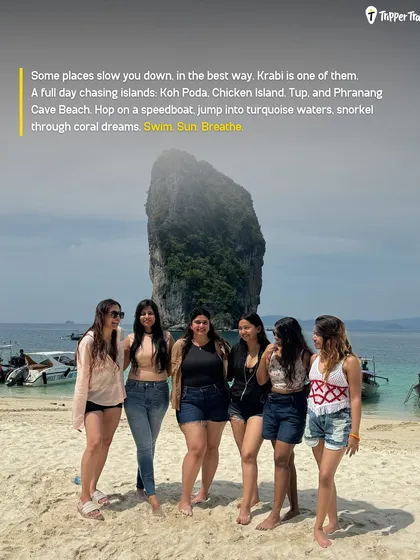 A group of women poses on a beach in Krabi, Thailand. A full day of island hopping to Koh Poda, Chicken Island, and more is a key part of the adventure. Swim, sun, breathe.