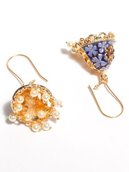 The blue bells of Bindhani. These small, lightweight jhumkis feature beautiful blue meenakari work and are fixed with a U-pin for easy wear.