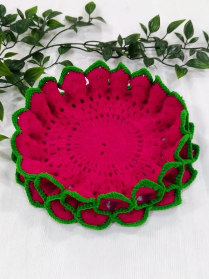 A single pink and green lotus aasan, showcasing its simple elegance against a white background.