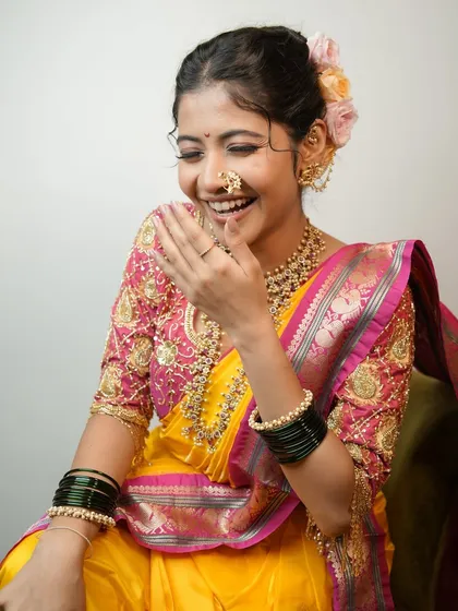 A candid laugh that lights up the photo, showcasing a natural and happy bride.