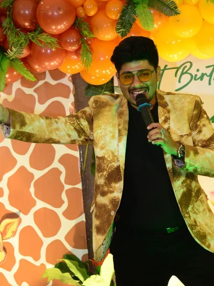 Leading the fun at a jungle-themed birthday party. As an emcee, I'm right in the middle of the action, guiding the games and making sure everyone is having a great time.