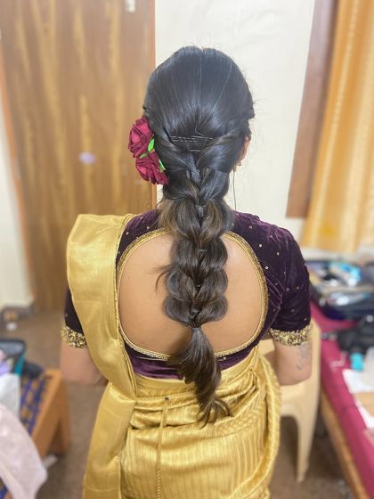 A simple and elegant braided hairstyle for a guest.