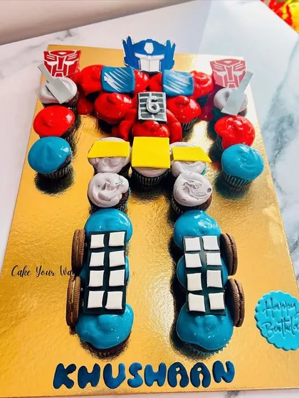 Transforming cupcakes into pure joy. This pull-apart Optimus Prime cake is a creative and fun alternative to a traditional cake.