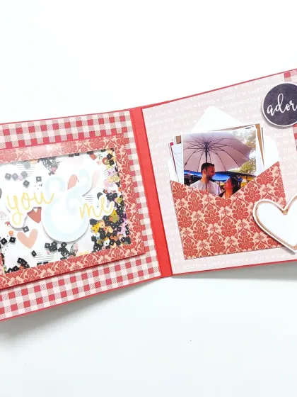 An inside look at how I bring your stories to life. This page features a playful shaker window with "you & me" confetti and a special pocket to hold a favorite photo, all tied together with a classic red and white theme.