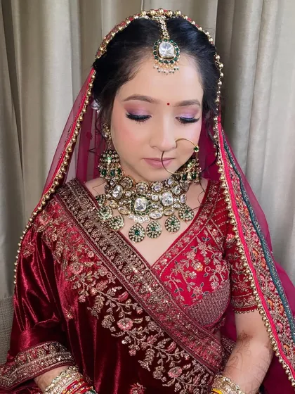 My bride Komal, looking absolutely radiant. I used soft purple and pink tones on her eyes to complement her beautiful velvet lehenga.