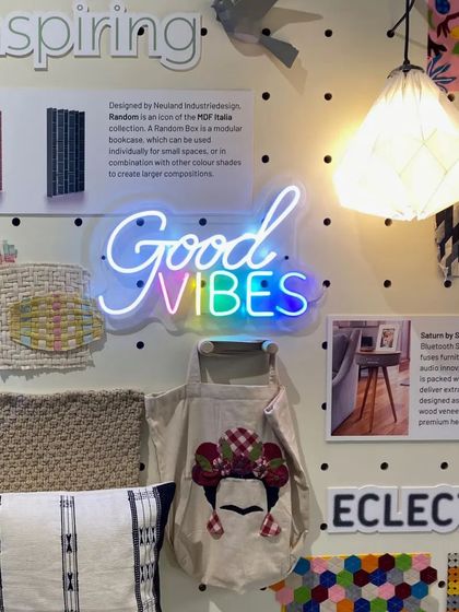 A mood board for the 'Solo Commerce' trend, featuring a 'Good Vibes' neon sign. This collection of inspiring and eclectic materials helped us design a space that captures the freedom and unconventional lifestyle of gig entrepreneurs.