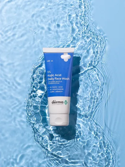 A top-down shot that uses water ripples to create a beautiful, natural texture. The face wash appears to float in a clear blue pool, reinforcing its cleansing and hydrating benefits.
