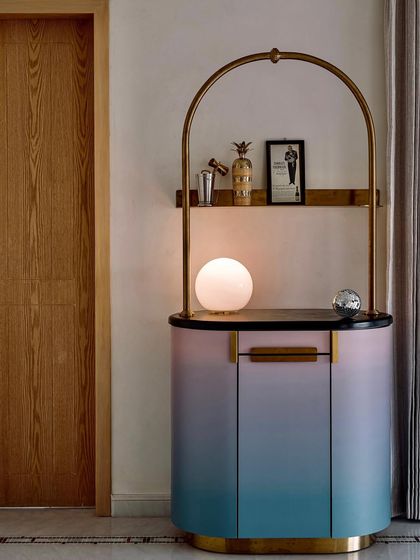 The 'Gradient Bar' with its globe light on, casting a warm and inviting glow. This piece is a perfect blend of art and function.