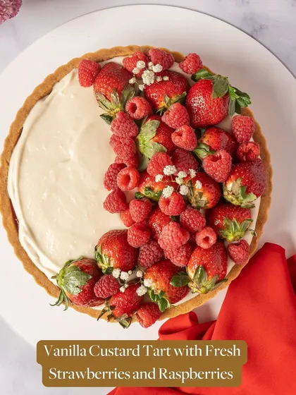 A beautiful Vanilla Custard Tart with Fresh Strawberries and Raspberries. The creamy custard and tart berries create a perfect balance of flavors.