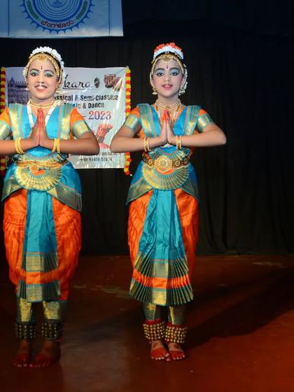 Our students Ruthvi and Dhanya after their performance at the Jhenkara festival. We celebrate every student's participation and success.