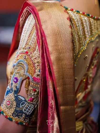 A closer look at the soul of my craft. This bridal blouse sleeve features elaborate zardosi and threadwork, with traditional motifs like the elephant symbolizing strength and prosperity, all meticulously hand-embroidered.
