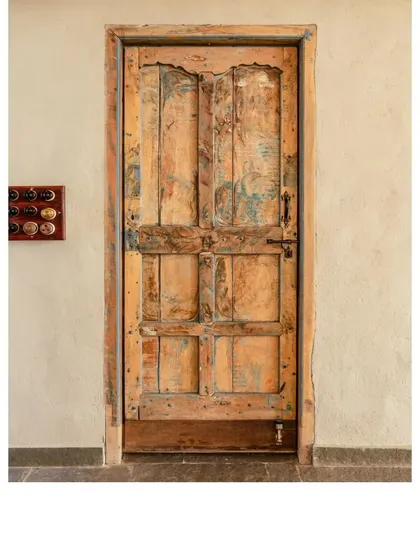 A beautifully distressed vintage door. Each repurposed piece we use carries its own identity and memories, adding a layer of soul to the spaces we design.