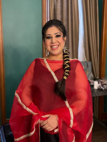 A happy and confident portrait of the client. The makeup enhances her beautiful smile and gives her a radiant glow.