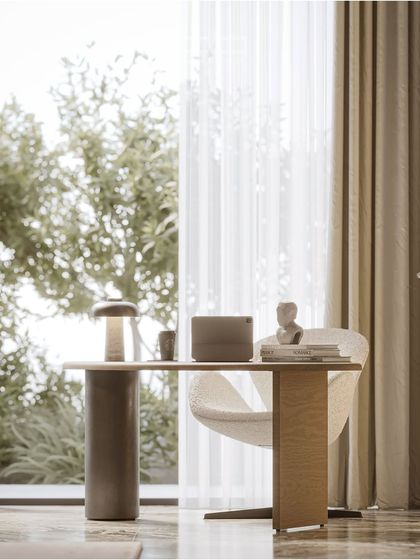 A simple, elegant workspace designed to inspire. The minimalist desk is positioned to take advantage of natural light from the large window, creating a calm and focused environment for work or reflection.