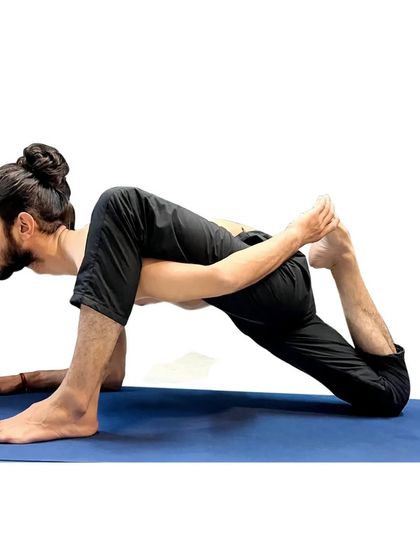 A lizard pose variation, a deep hip and quadriceps stretch.