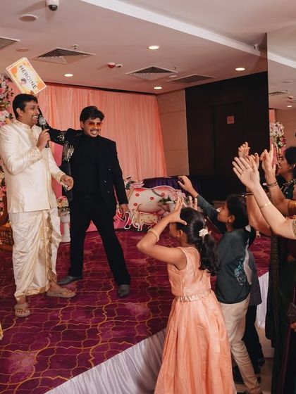 "Laughter is my favorite mic check!" A candid moment of me sharing a laugh with the guests. When the audience is happy, I know the event is a success.