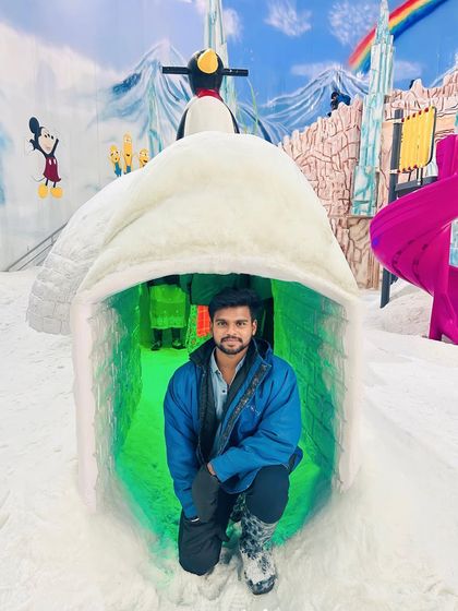 Having fun inside one of the ice igloos at Snow City.