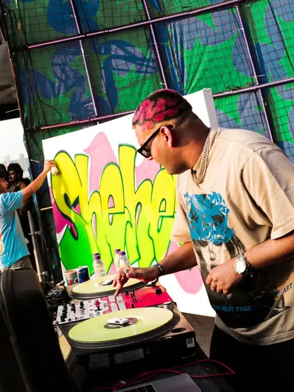 Me painting my 'Sheher' piece live on stage at NH7 Weekender, with DJ The Spindoctor right next to me. It was a true fusion of hip-hop elements.