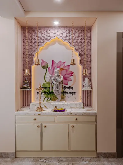 A serene mandir design featuring a beautiful Krishna idol against a lotus backdrop, framed by an arch with intricate patterns and hanging bells.