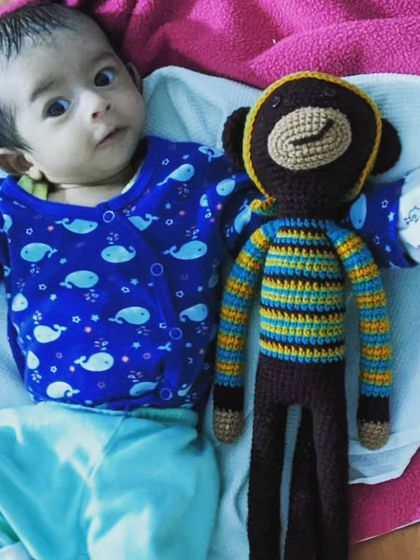 A precious moment between a little munchkin and his new long-legged monkey toy. It’s so rewarding to see my handmade creations bring smiles to little faces.
