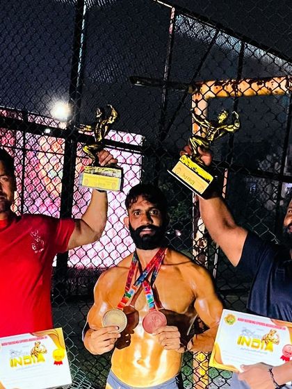 Celebrating the win with my champion Akash Thakur. Holding up the trophies is a feeling that never gets old. This is what we train for.