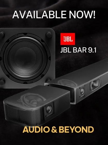 A close-up of the JBL Bar 9.1's speaker components. This shot reveals the engineering inside the main bar and the up-firing drivers in the detachable units that create the Dolby Atmos height effects.
