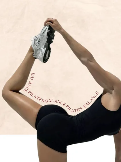 This artistic shot of a deep stretch perfectly captures the balance of strength and flexibility that is at the heart of Pilates.