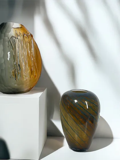 Earthy tones, fluid textures, and timeless craft. My new blown glass vases, shown here together, are designed to stand out, even when standing still, adding a touch of organic modernism.