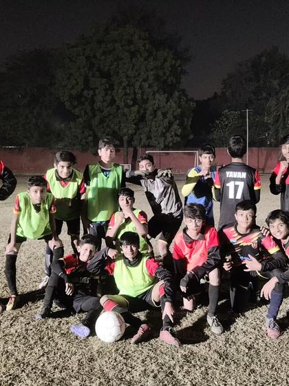 The winning team after an internal practice match, all smiles and good vibes.