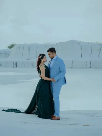 A classic couple portrait at the Kishangarh dumping yard. The contrast between the formal attire and the unusual, natural landscape is what makes these shots so special.