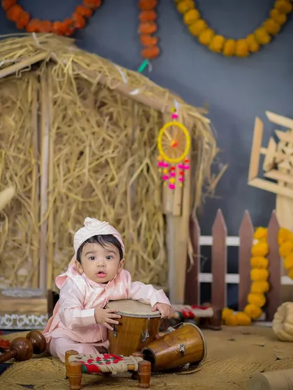 This baby is all set for the Lohri festivities, looking adorable in his traditional attire while playing with a dhol.