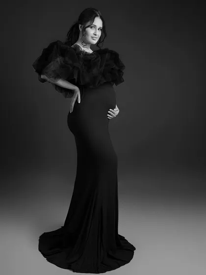 A full-length black and white portrait that feels both classic and modern.