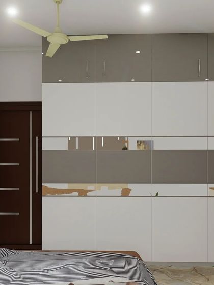 This view shows the full length of the wardrobe and its mirrored accent, which adds functionality and a sense of space to the room.