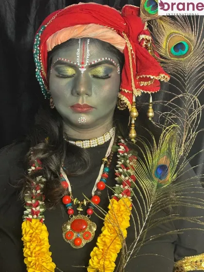 The full look, complete with a peacock feather and floral garlands, showcases the creativity involved in our fantasy makeup classes.